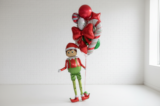 Elf figure and festive balloons 