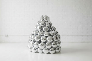 A lifesize chocolate balloon sculpture designed to look like a stack of chocolate bars, with a 'Happy Birthday' balloon at the top.