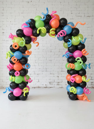 80s themed arch with black and neon colors