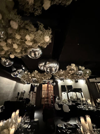 Chrome orbs and floral ceiling wedding event decor with the 99 Haus Balloons and Decor custom event service