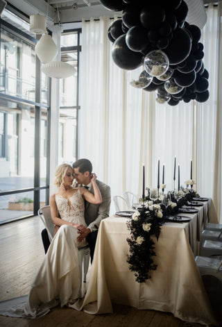 Black and chrome ceiling wedding event decor with the 99 Haus Balloons and Decor custom event service