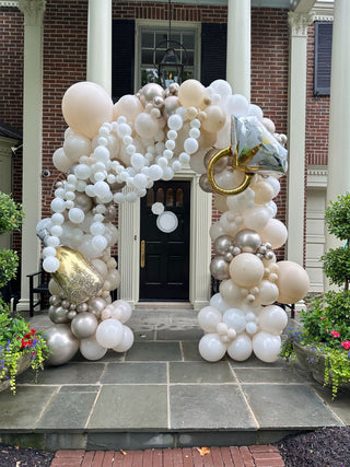 White and beige balloon arch wedding event decor with the 99 Haus Balloons and Decor custom event service