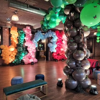 Jungle themed corporate balloon installation with the 99 Haus Balloons and Decor custom event service