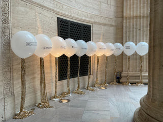 White balloon corporate balloon installation with the 99 Haus Balloons and Decor custom event service