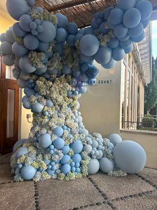 Baby blue and floral balloon arch corporate balloon installation with the 99 Haus Balloons and Decor custom event service