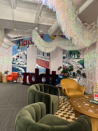 White metallic fringe corporate balloon installation with the 99 Haus Balloons and Decor custom event service