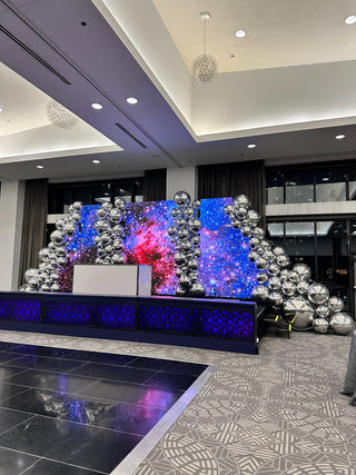 Silver chrome metallic balloon wall corporate balloon installation with the 99 Haus Balloons and Decor custom event service