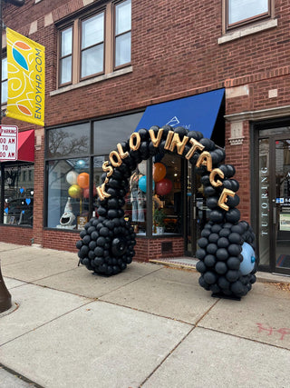 Black and gold balloon arch corporate balloon installation with the 99 Haus Balloons and Decor custom event service