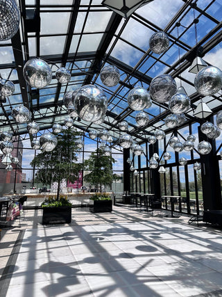 Chrome silver balloon ceiling corporate balloon installation with the 99 Haus Balloons and Decor custom event service
