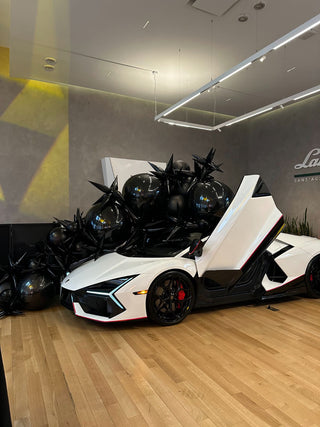 Black star balloons and orbs corporate balloon installation with the 99 Haus Balloons and Decor custom event service