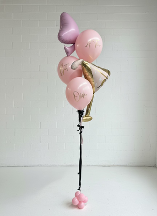 a tini bit older balloon bouquet in pink