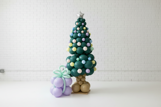 Decorative Christmas tree with colorful ornaments in a room setting.