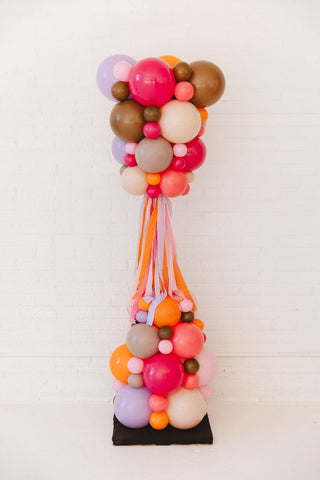 Colorful balloon arrangement on a white background