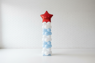 Balloon column with a red star at the top made of white and blue balloons