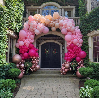 Pink and beige arch balloon installation with the 99 Haus Balloons and Decor custom event service