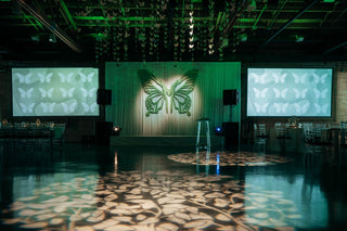 Bat Mitzvah bright green butterfly ceiling installation with the 99 Haus Balloons and Decor custom event service