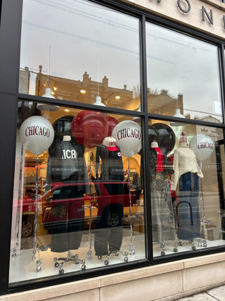 Chicago storefront window corporate balloon installation with the 99 Haus Balloons and Decor custom event service