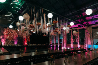 Bat Mitzvah bright pink and floral ceiling decor with the 99 Haus Balloons and Decor custom event service