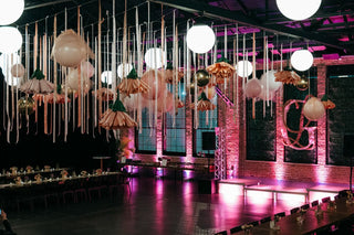 Bat Mitzvah bright pink and floral ceiling decor with the 99 Haus Balloons and Decor custom event service