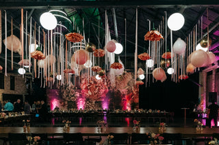Bat Mitzvah bright pink and floral ceiling decor with the 99 Haus Balloons and Decor custom event service