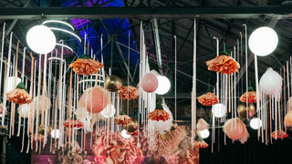 Bat Mitzvah bright pink and floral ceiling decor over dance floor with the 99 Haus Balloons and Decor custom event service