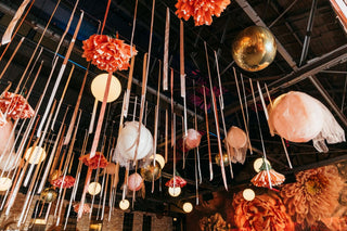 Bat Mitzvah bright pink and floral ceiling decor with the 99 Haus Balloons and Decor custom event service