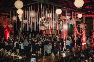 Bat Mitzvah bright pink and floral ceiling decor over dance floor with the 99 Haus Balloons and Decor custom event service