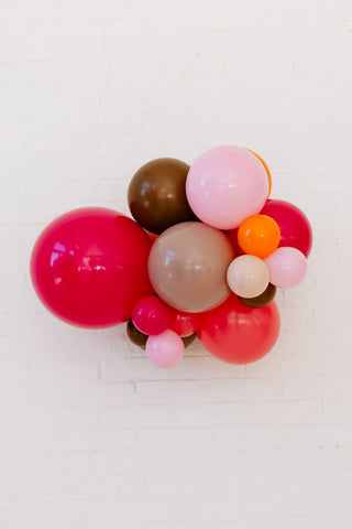Colorful balloon arrangement on a white background