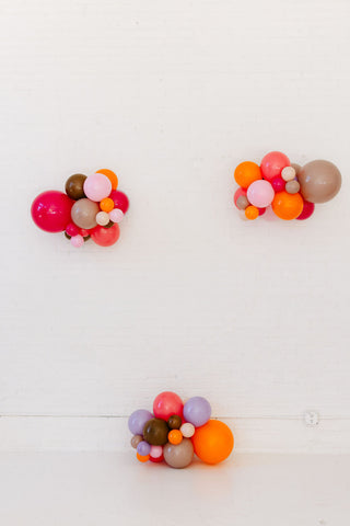 Colorful balloon arrangements on a white background