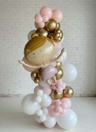 A free standing garland featuring a variety of balloons in pink, gold, and white colors, arranged in a spiral pattern.
