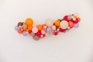 Colorful balloon arch on a white background