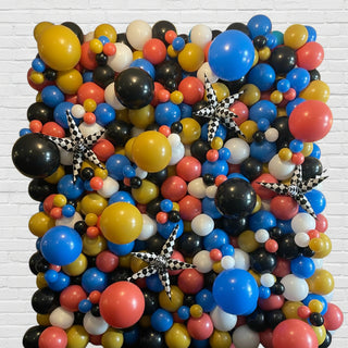 a wall of arranged balloons