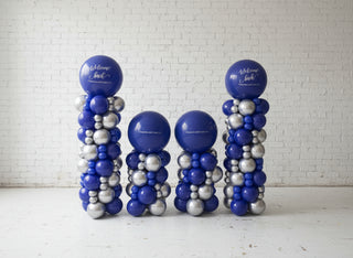 a series of corporately branded balloon columns of different sizes. 