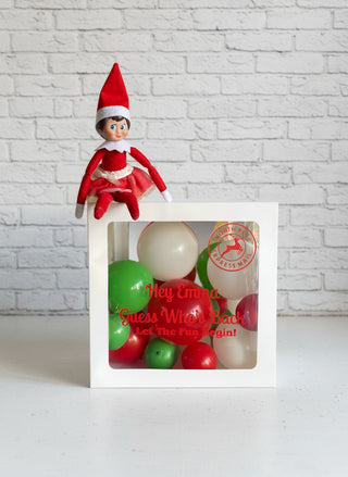 A white mailbox-shaped balloon display with a red and white striped top resembling a Christmas hat, set against a plain background.