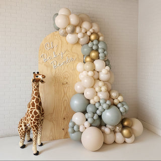 a neutral backdrop paired with a stuffed giraffe