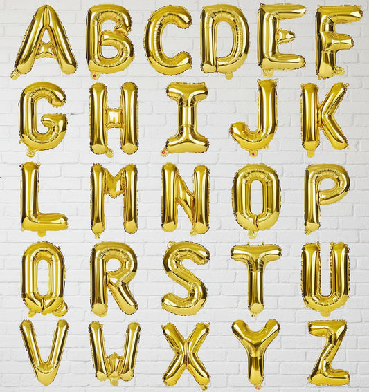 Gold letter balloons spelling out the alphabet on a white background