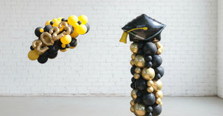 A graduation-themed balloon garland and column decoration bundle with a mix of black, gold, and yellow balloons.