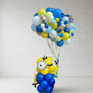 A balloon backdrop featuring a minion character from Despicable Me, surrounded by blue and yellow balloons.