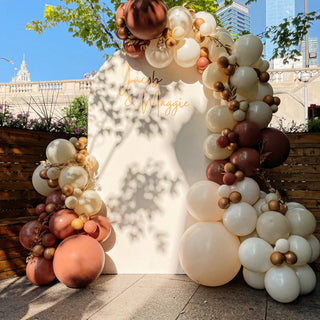 An outdoor backdrop with balloons