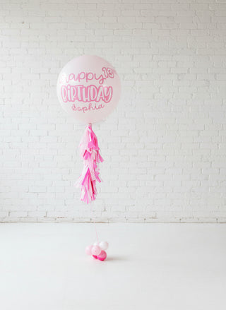A pink jumbo balloon for a birthday