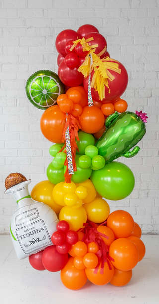 Balloon sculpture resembling a bottle of tequila with colorful balloons on a white background